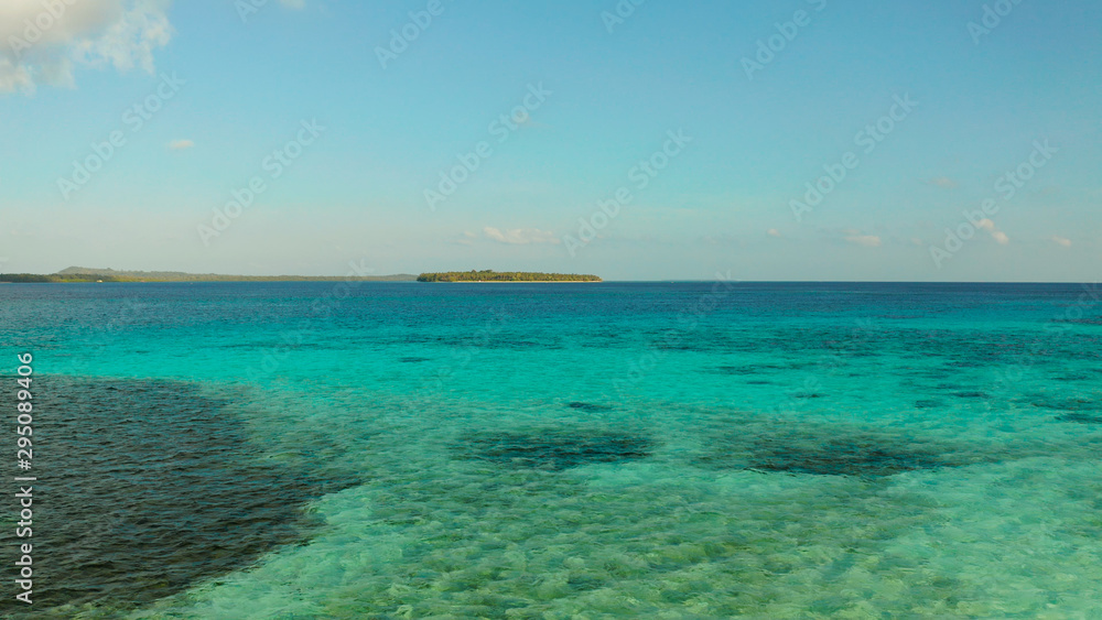 Sea water surface in lagoon with tropical islands copy space for text. Summer and travel vacation concept.