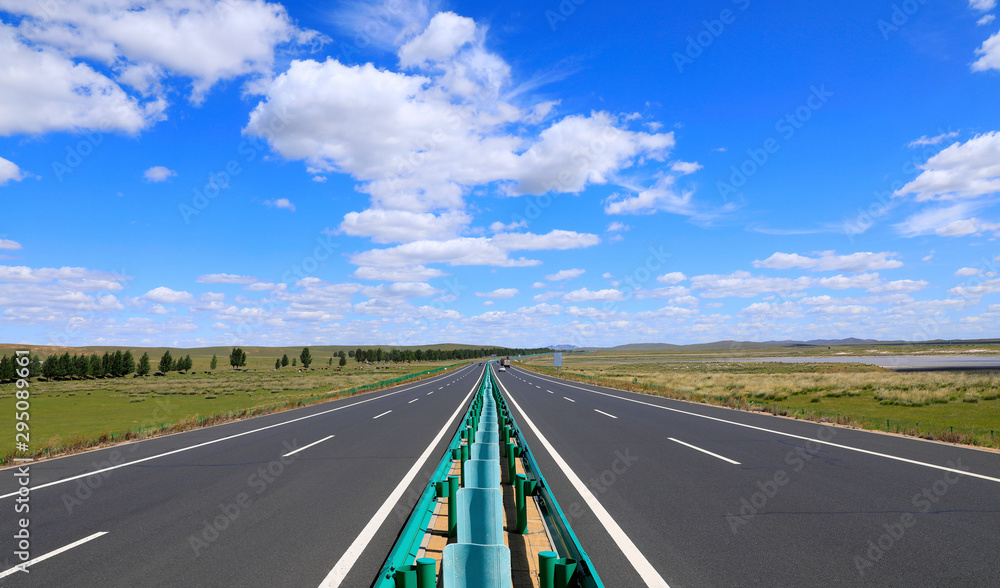 Fototapeta premium Beautiful highway, under the blue sky and white clouds