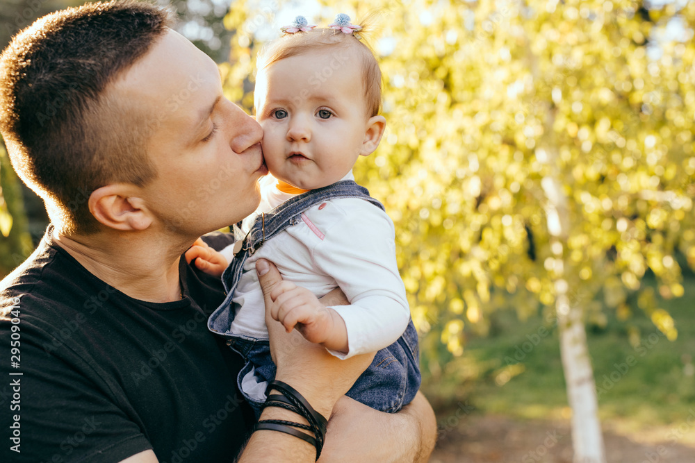 Fototapeta premium Happy younfather and her child enjoy the sunset outdoor - Image