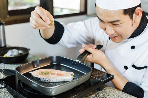Asian Chef cooking in kitchen restaurant