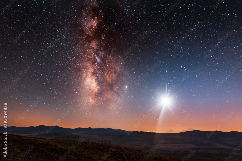 Beautiful milky way galaxy and moon over the hill. Night landscape, astronomical background.