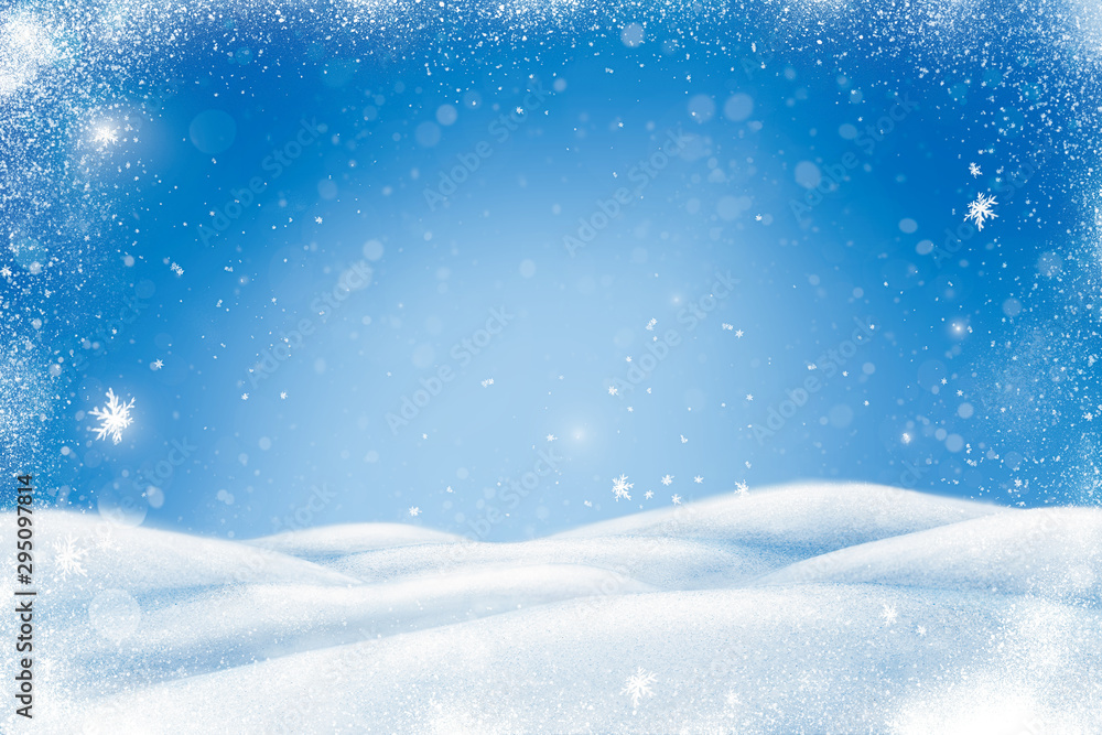 Winter Christmas landscape with snow, snowdrifts and snowfall. Blue background with copy space for your text.