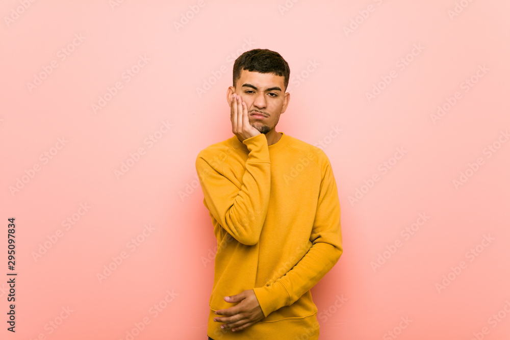 Young hispanic man who is bored, fatigued and need a relax day. Young hispanic man who is bored, fatigued and need a relax day.