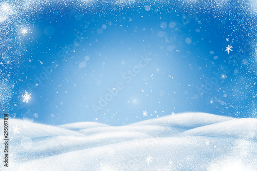 Winter Christmas landscape with snow, snowdrifts and snowfall. Blue background with copy space for your text. © Tatyana Sidyukova