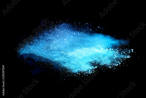 Blue powder explosion on black background.
