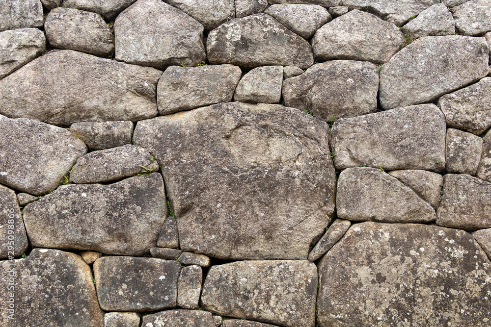 Fototapeta premium Natural stone abstract background wall made by ancient Inca of Peru in South America. Background with copy space
