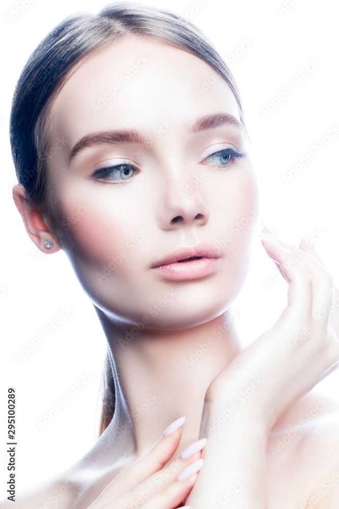 Close-up beauty face of young woman touching healthy perfect skin. Natural nude make-up, blue eyes, hair style. White background Close-up beauty face of young woman touching healthy perfect skin. Natural nude make-up, blue eyes, hair style. White background