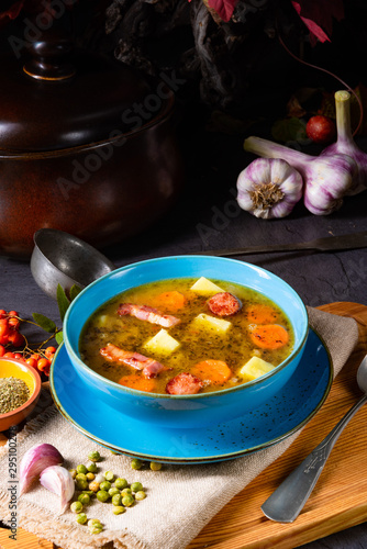 polish pea soup (grochowka) with smoked bacon and sausage photo