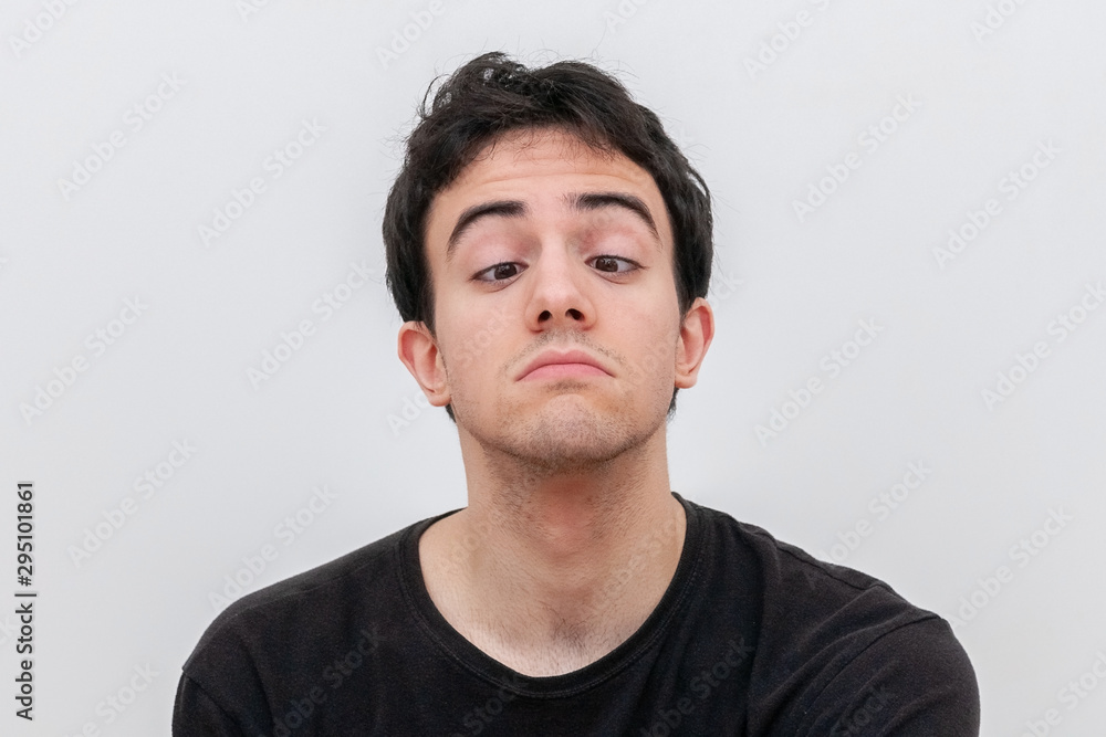 young man indulges on a white background young man indulges on a white background