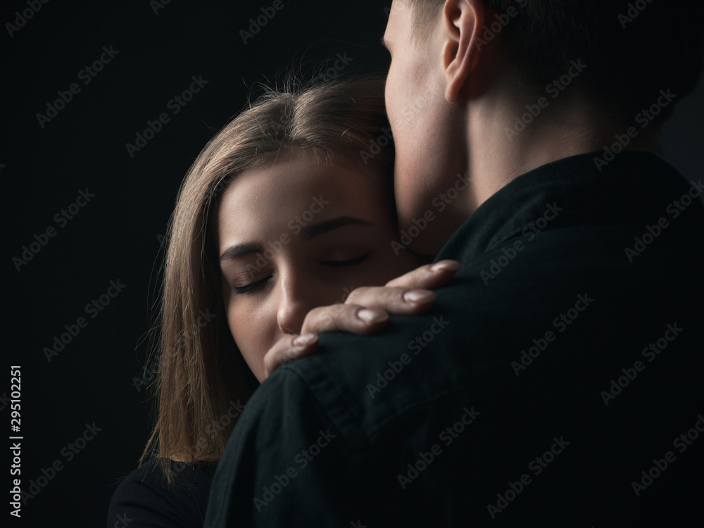 Portrait of passionate young couple in love. Close up. Low key Portrait of passionate young couple in love. Close up. Low key