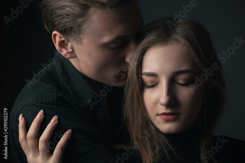 Portrait of passionate young couple in love. Close up.