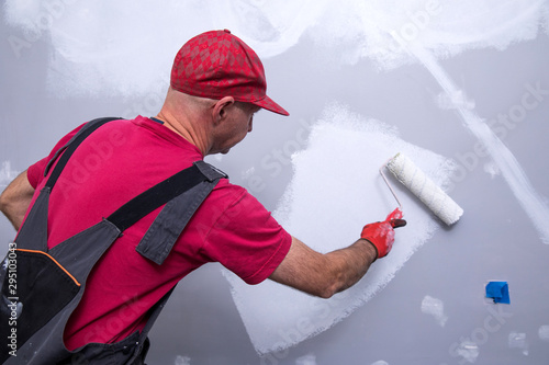 House Painting Business, Tradesman painting a wall