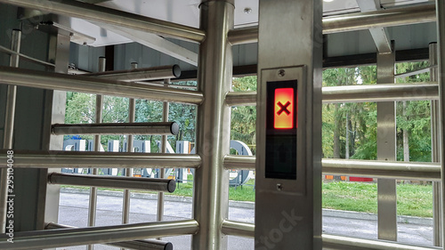 Turnstiles. Checkpoint. Automatic access control. Automatic turnstile with sliding doors to control the flow of people. Entrance hall with turnstile