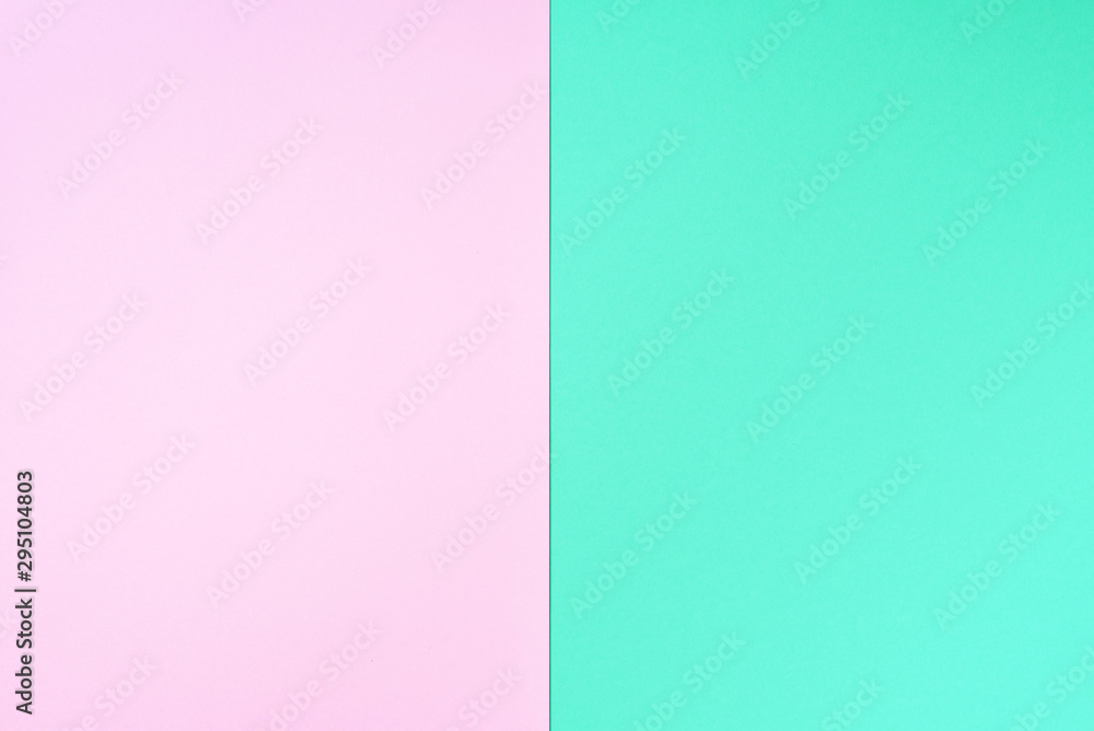 Colorful trendy green and pink paper background. Top view. Copy space