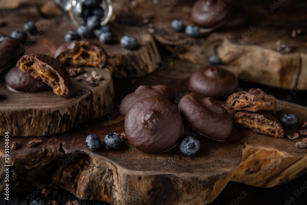 Chocolate biscuit. Crispy and crumbly delicious cookies with natural ingredients: flour, nuts, seeds, pieces of chocolate, cocoa, fruit jams. Beautiful wallpaper. Stylish still life for poster. Chocolate biscuit. Crispy and crumbly delicious cookies with natural ingredients: flour, nuts, seeds, pieces of chocolate, cocoa, fruit jams. Beautiful wallpaper. Stylish still life for poster.