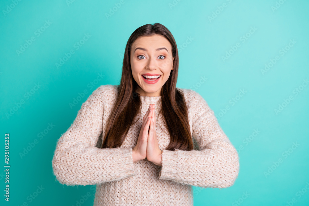 Fototapeta premium Photo of cheerful charming cute pretty nice glad girlfriend begging someone wearing jumper while isolated with turquoise vibrant color background