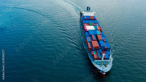 Aerial view cargo ship transportation of business logistic sea freight, Cargo ship, Cargo container in factory harbor at industrial estate for import export around in the world, Trade Port / Shipping