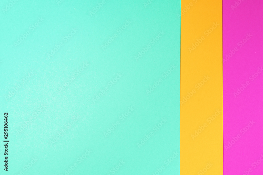 Obraz premium Background in trendy green, pink and yellow colors. Fashionable paper. Top view. Minimal concept. Trendy mint color
