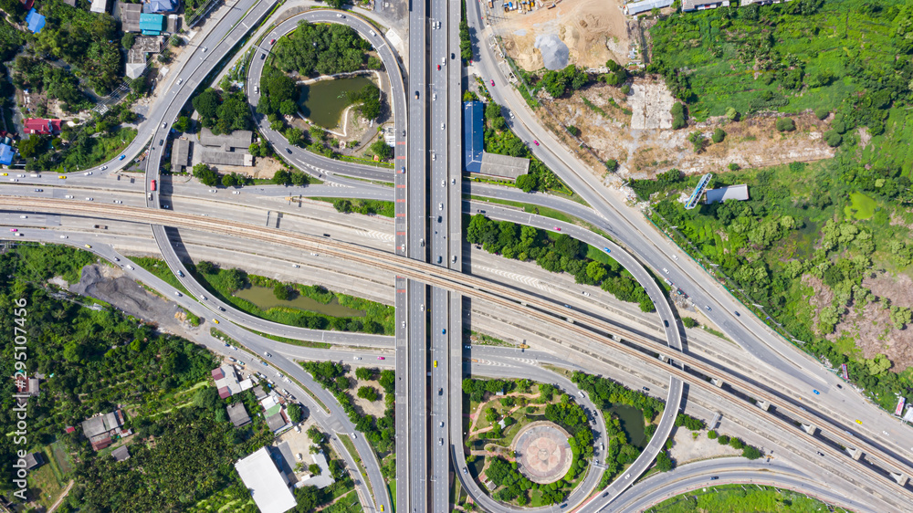 Rail track and conductor rail top view, Road Expressway traffic an important infrastructure with moving cars and railway tracks on which the train rides in Bangkok Thailand. Rail track and conductor rail top view, Road Expressway traffic an important infrastructure with moving cars and railway tracks on which the train rides in Bangkok Thailand.