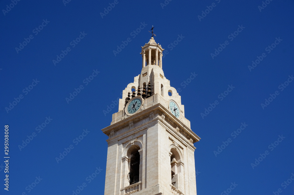 White high clock tower blue sky background