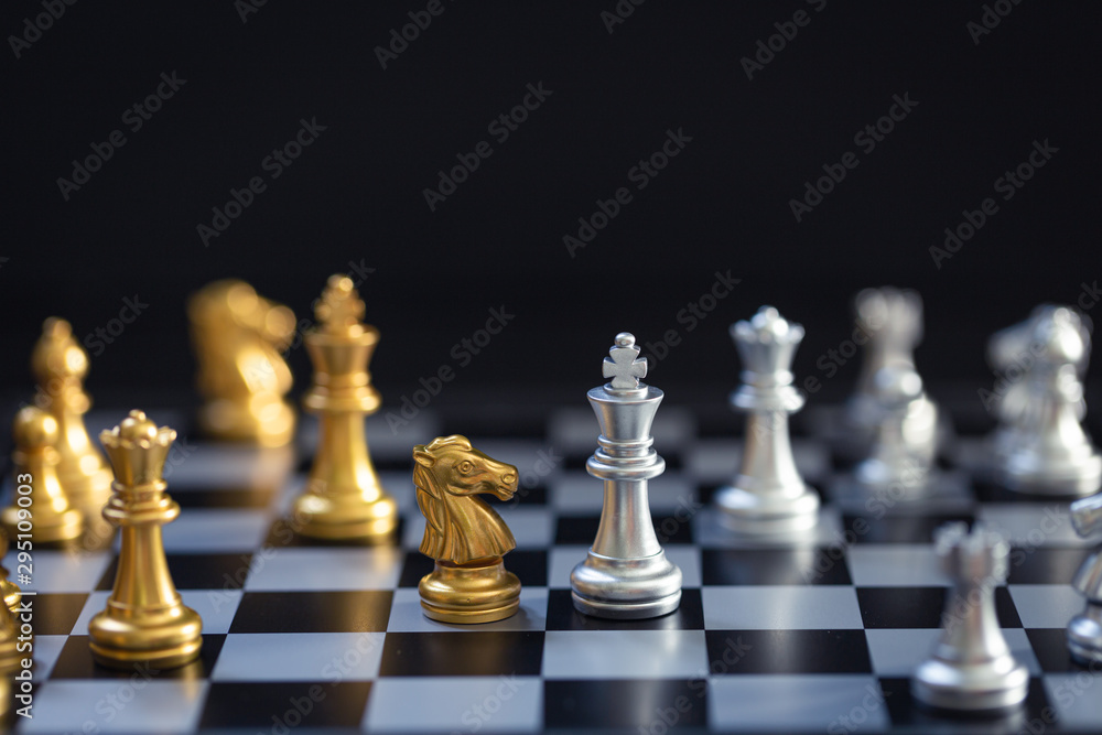 Chess game, set the board waiting to play in both gold and silver pieces blur Chess game, set the board waiting to play in both gold and silver pieces blur