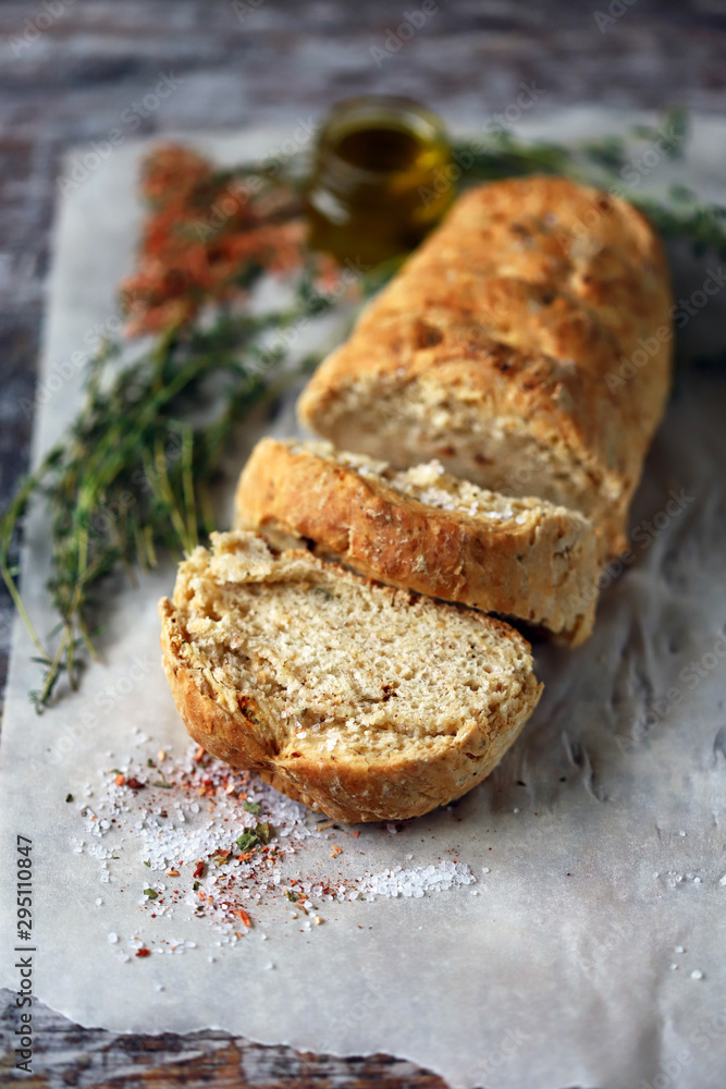 Homemade Italian bread with herbs and spices. Selective focus. Macro.