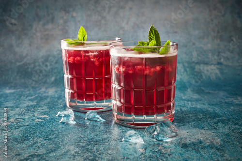 Elderberry cordial with ice and mint in glass close up