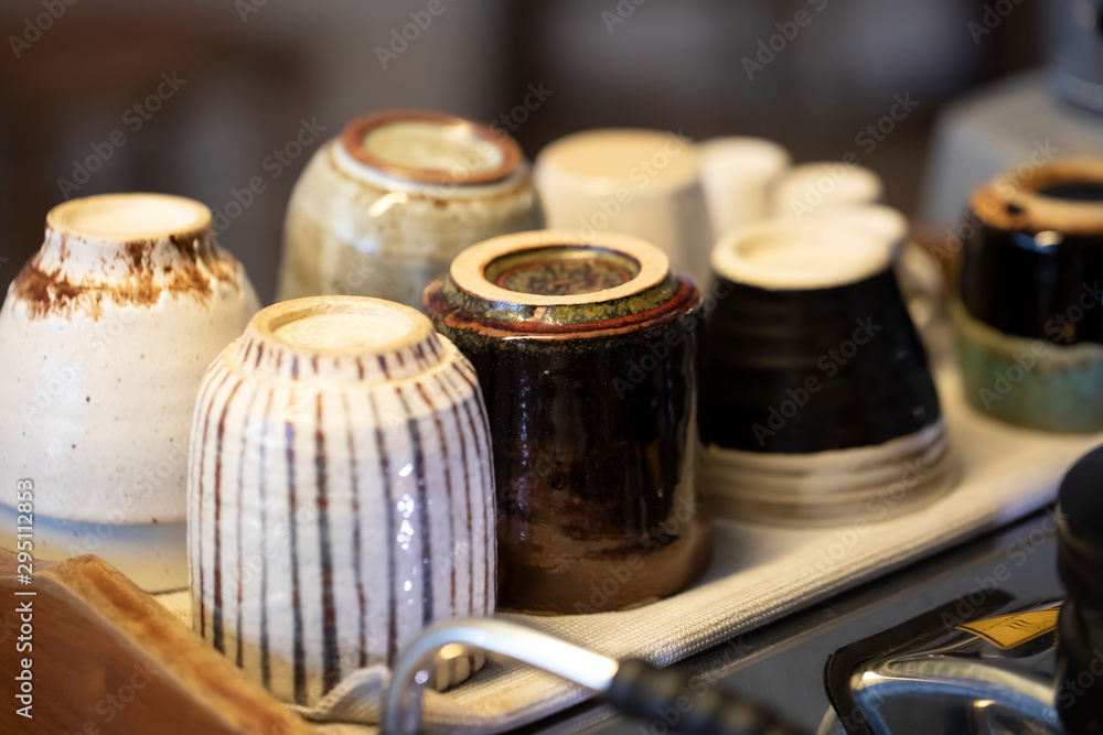Step by step coffee making part nine. Cups are stored and heated above the coffee maching Step by step coffee making part nine. Cups are stored and heated above the coffee maching