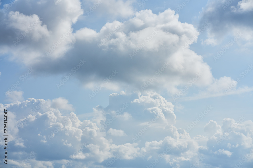 Fototapeta premium Blue sky and fluffy white clouds. Clouds in the blue sky