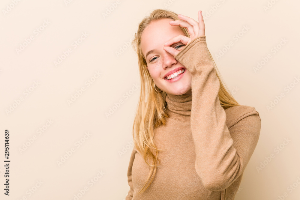 Cute and natural teenager woman excited keeping ok gesture on eye. Cute and natural teenager woman excited keeping ok gesture on eye.