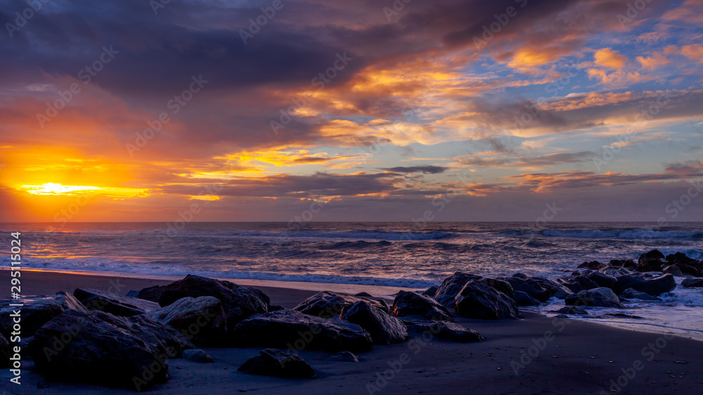 Sunset at Hokitika beach in New Zealand