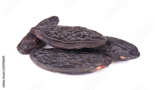 Tonka beans isolated on white background. Bean of Dipteryx odorata, cumaru or kumaru. Fresh aroma tonka beans.