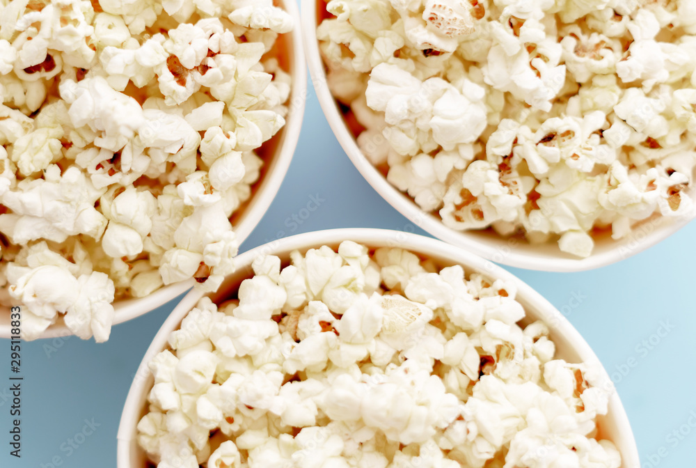 Popcorn in buckets. Three buckets with popcorn, top view. Popcorn in buckets. Three buckets with popcorn, top view.