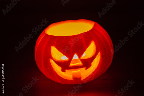 Glowing Halloween pumpkins isolated on dark background, Jack o lantern