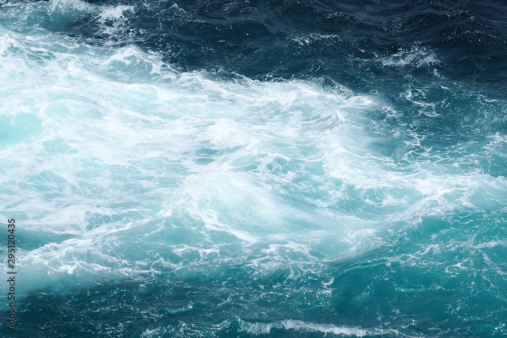 Beautiful top view of powerful waves in blue and turquoise ocean. Nature and lifestyle, inspiration, motivation environment concept Beautiful top view of powerful waves in blue and turquoise ocean. Nature and lifestyle, inspiration, motivation environment concept