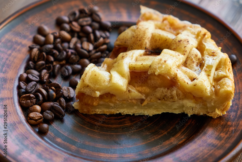 piece of peach pie on a plate with coffee beans Close up piece of peach pie on a plate with coffee beans Close up