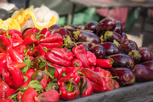 Red pepper, eggplant and pumpkin at the market, autumn harvest sale, selective focus