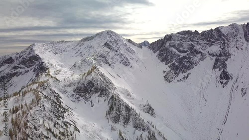 Aerial reveal shot of Golden Larches, Alpine Larches on mountain slopes, Manning Park. British Columbia
 photo