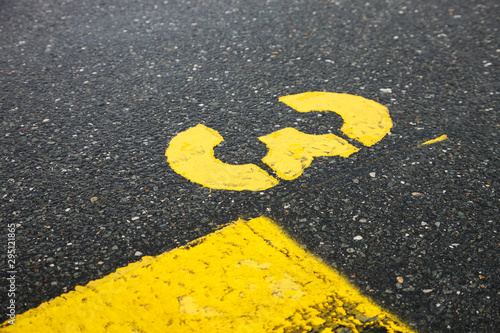 yellow number three  isolated road sign painted on asphalt for background, motor race start number © YK