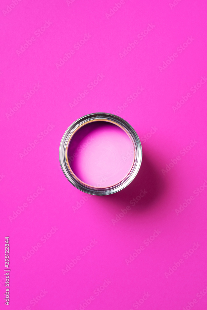 Open paint can with on trendy pink background. Top view, copy space. Appartment renovation, repair, building and home design concept. Open paint can with on trendy pink background. Top view, copy space. Appartment renovation, repair, building and home design concept.