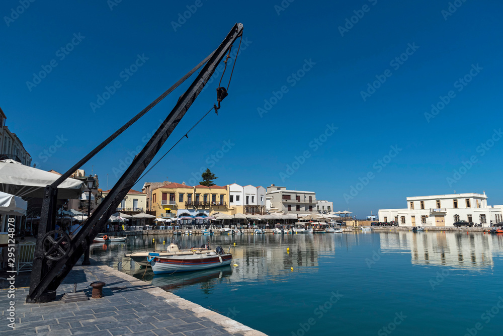 Rethymno, Crete, Greece. September 2019.  Small fishing boats on the historic old venetian harbour a popular  tourist attraction in Rethymno, Crete.