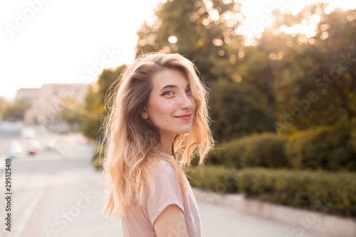 Portrait of young beautiful woman on the street