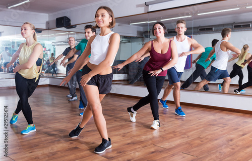 Men and ladies dancing zumba