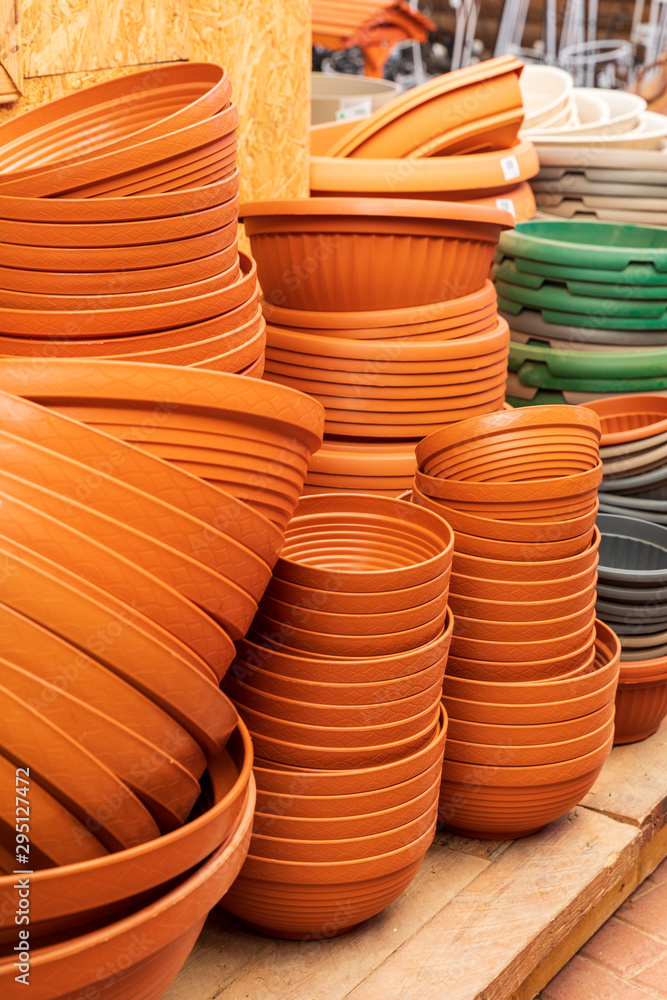 The pladtic pots on the shelves in the greenhouse The pladtic pots on the shelves in the greenhouse