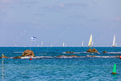 The Israeli flag on the Andromeda's Rock in Jaffa in a wind