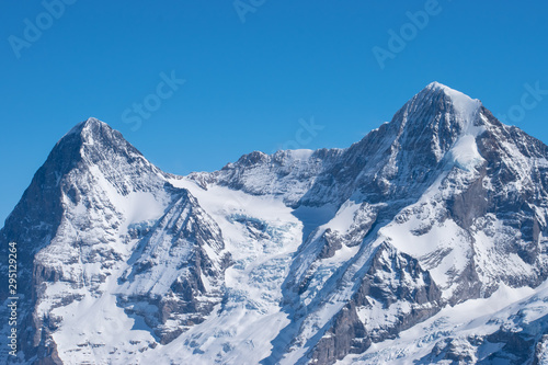 Swiss mountain peak after snowfall with panoramic view of Murren Jungfrau ski region.