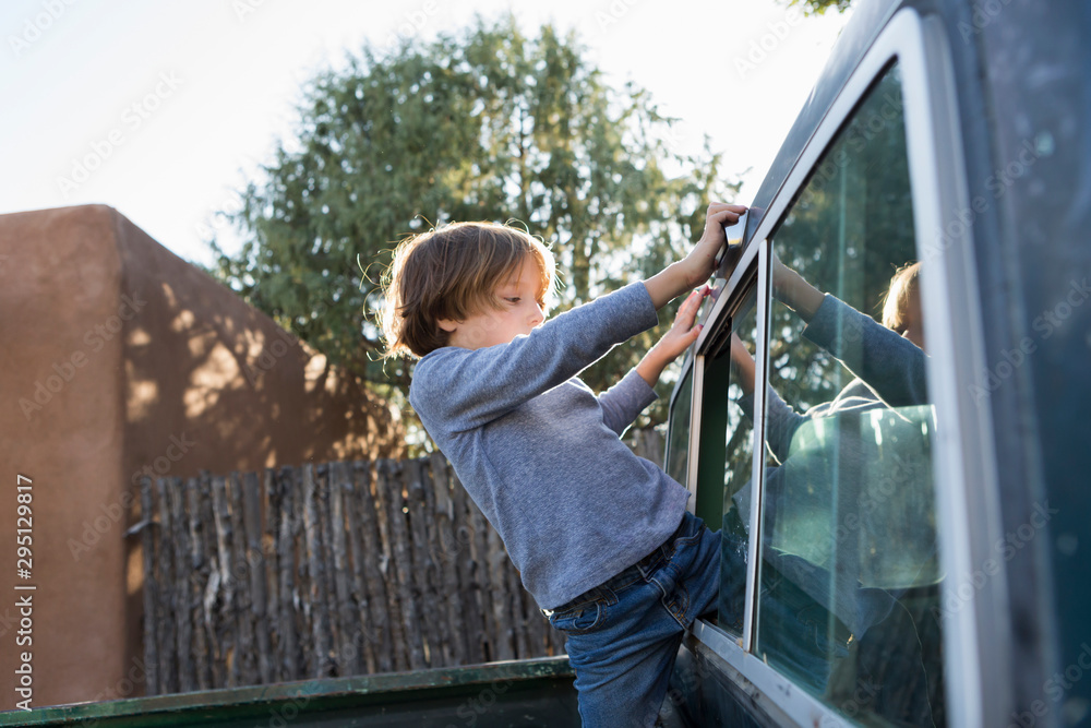 6 year old boy in 1970's era pick up truck 6 year old boy in 1970's era pick up truck