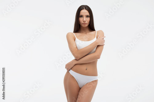 Sensual woman in underwear looking at camera alluringly photo