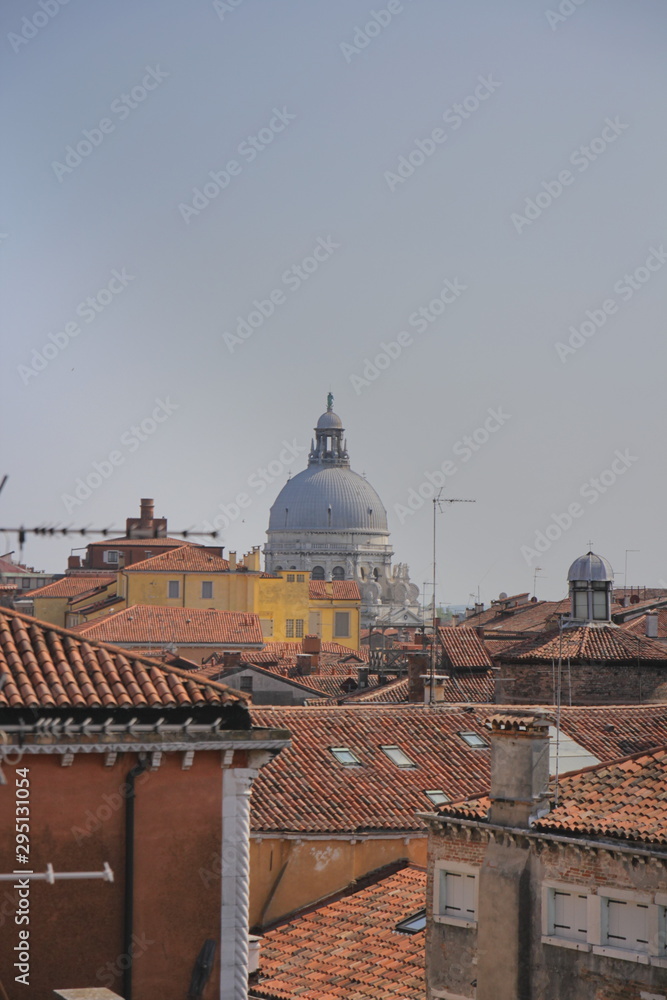 View of Venice from the tower of the palace of Contarini del Bovolo - very old buildings, tiled roofs. There is a place for writing text (in the sky)