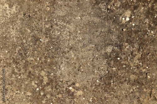 Spotty rough concrete surface with a non-uniform brown color.